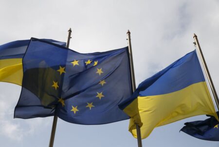Ukrainian and EU flags fly in front of the Presidential Administration in Kiev
